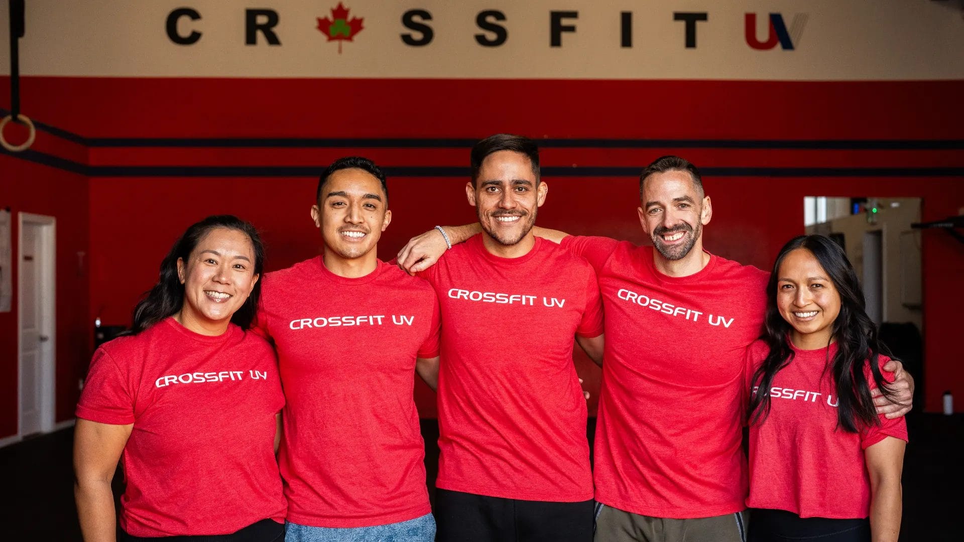 2 girls and 3 mans in red shirts